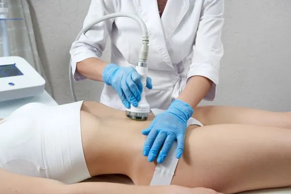 Lost the Weight but Not the Loose Skin? 2 woman having HIFU treatment on her stomach to combat loose skin Rutland following weight loss